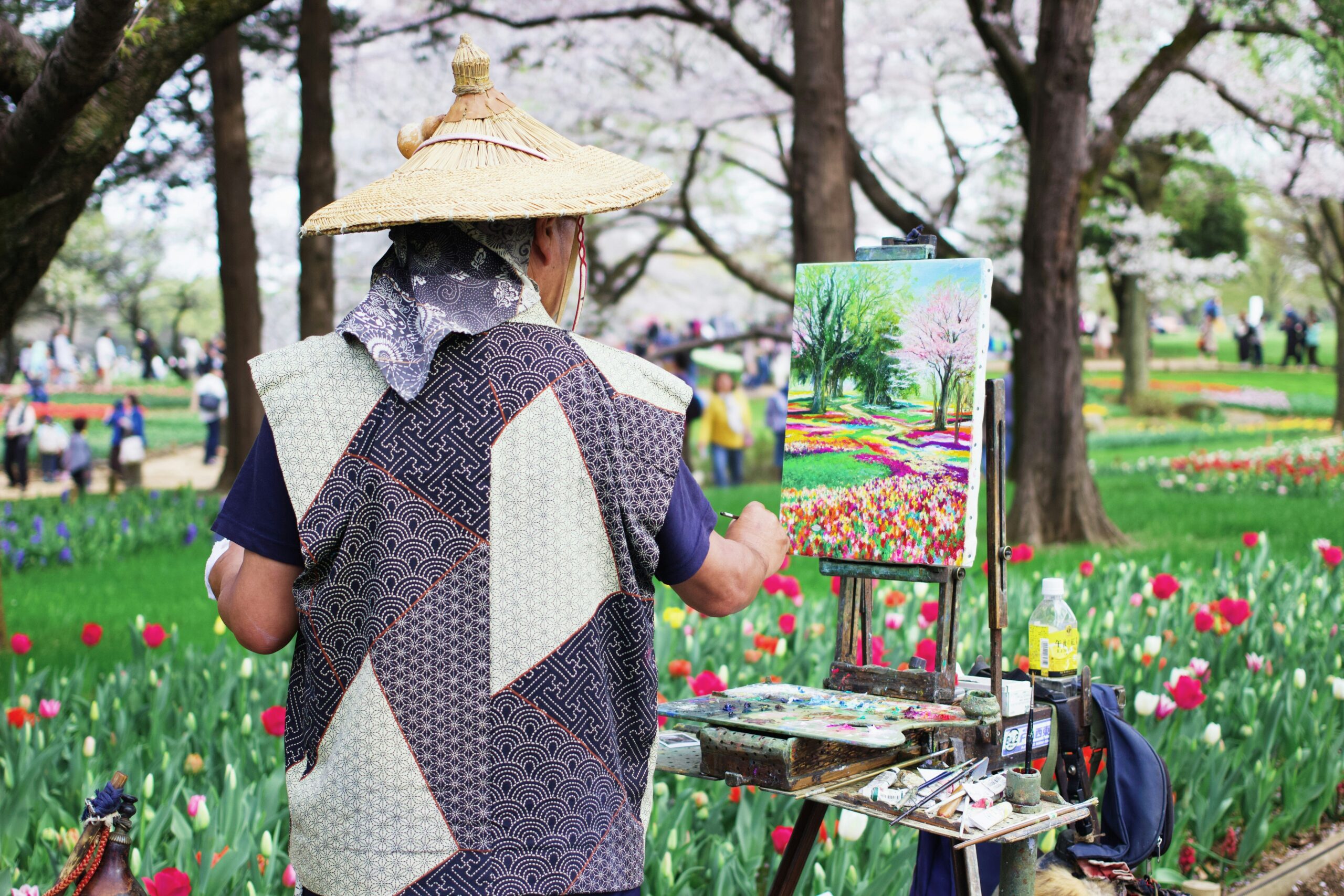 Person painting outdoors as a self-care activity for stress