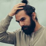 man holdin hair , stress about hairfall