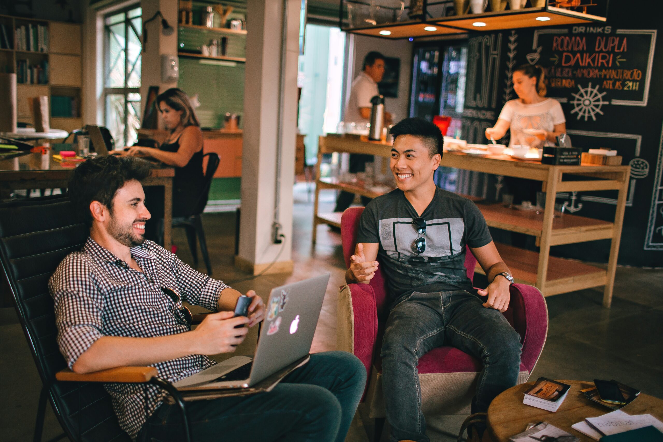 Group of supportive friends laughing together, representing positive social circle